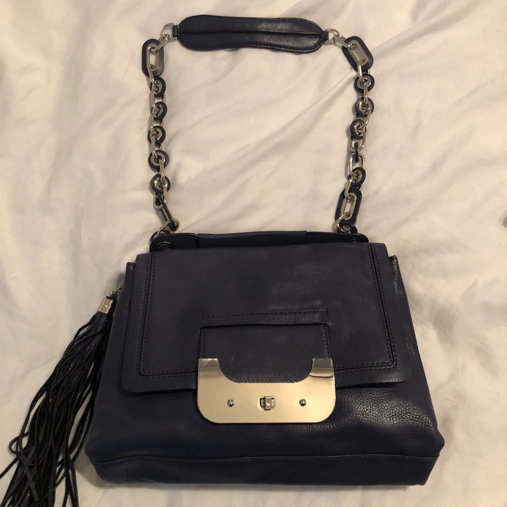 DVF Harper Connect bag in mulberry color.